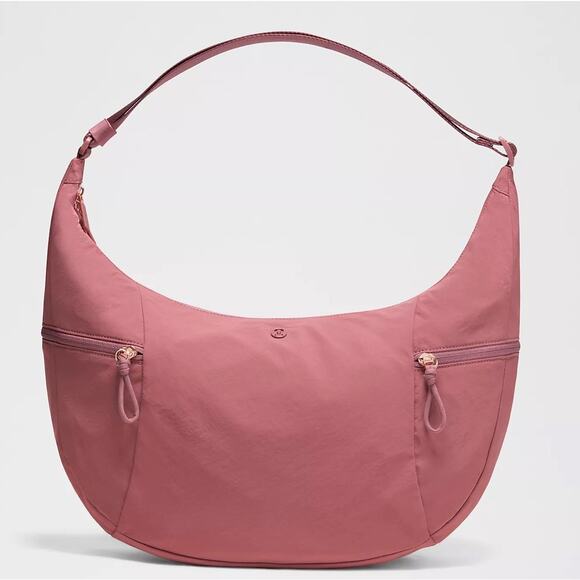 Lululemon Handbags - lululemon Large Slouchy Sling Bag 13L in the Dusk colorway.